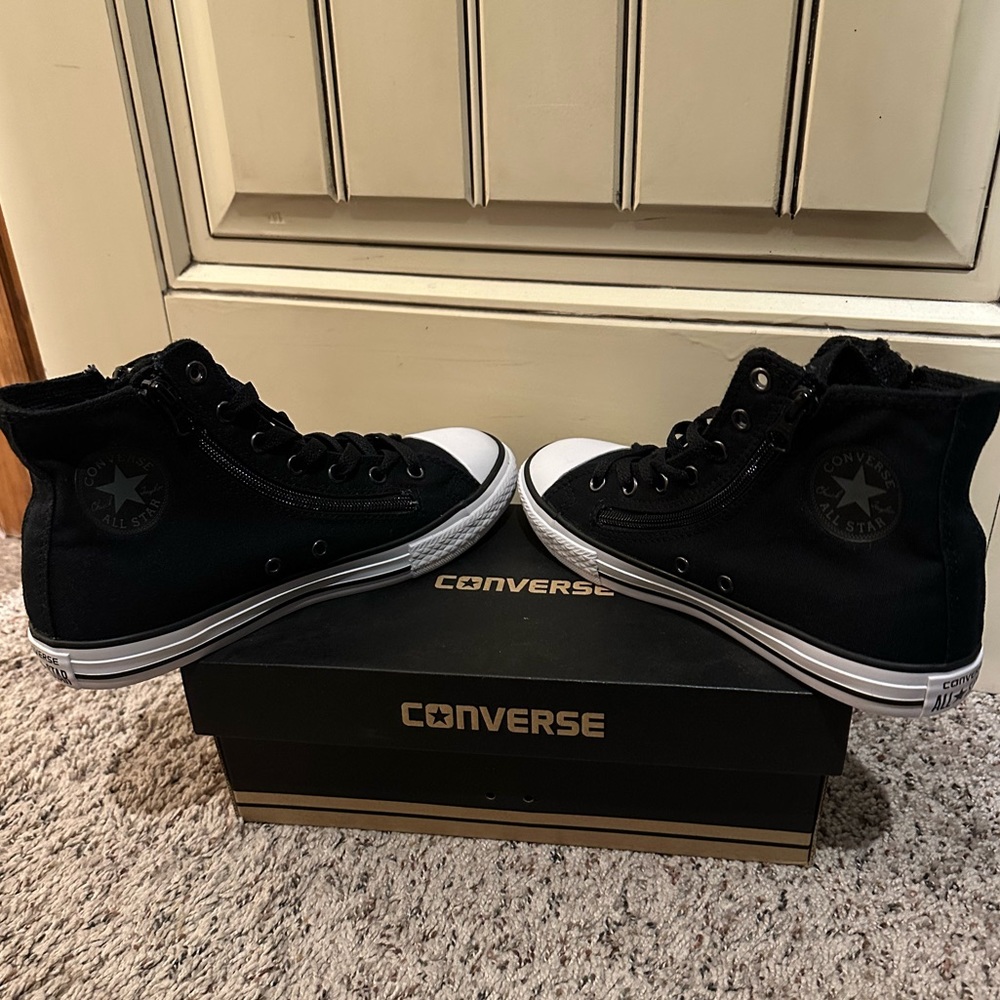 All Star converse size 5 juniors zippers jet black and never worn.